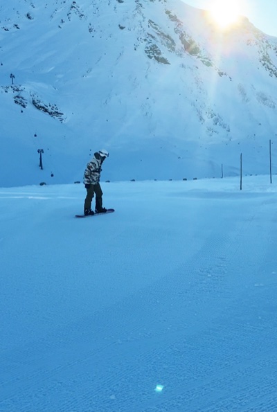 Sergei Liebich snowboarding in the mountains